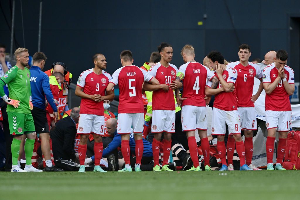 Denmark players protect Eriksen as he receives CPR