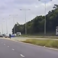 WATCH: Staggering moment police pull over man on e-scooter trying to join motorway