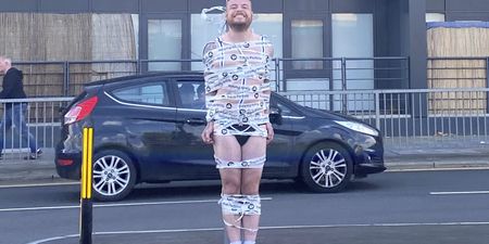 Semi-naked groom taped to traffic light in hilarious stag do prank