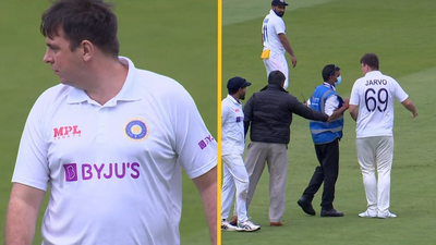 Cricket fan dressed as Indian player removed from pitch by stewards