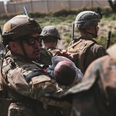 Baby seen lifted over Kabul airport fence reunited with dad