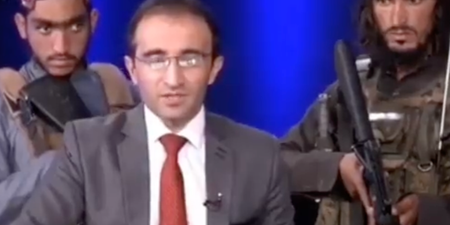 Shocking footage shows reporter read the news surrounded by armed Taliban