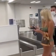 Woman walks through airport wearing just bikini – and a face mask