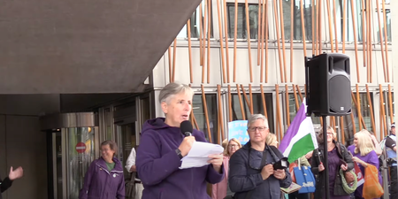 Anti-trans protesters wearing suffragette colours boo Nicola Sturgeon