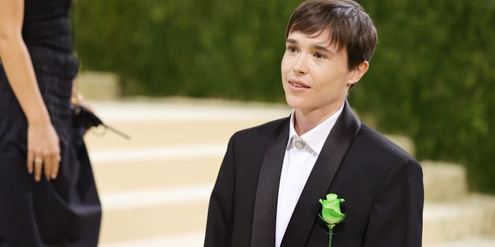 Elliot Page wearing green flower on Met Gala suit