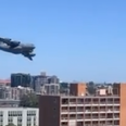Cargo jet weaves through skyscrapers in Brisbane in tense moment
