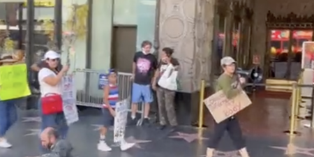 Homeless person perfectly shuts down anti-vaxx protest