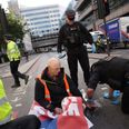 Insulate Britain protestors glue themselves to ground to prevent police arrest