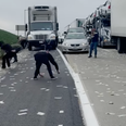 Armoured truck spills money across motorway as drivers go wild in cash grab