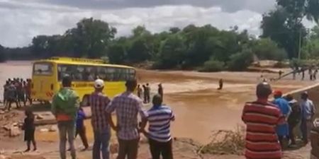 Shocking footage shows moment bus sinks as it crosses flooded road – leaving over 20 dead