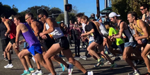 Elite runner pooed down leg 7 miles into marathon and completes run in personal best time