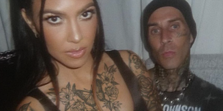 Kourtney Kardashian seen with body covered in tattoos as she poses with Travis Barker