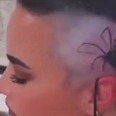 Demi Lovato tattoos giant spider on their head