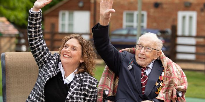Colonel Tom Moore and his daughter Hannah celebrate his 100th birthday, with an RAF flypast provided by a Spitfire and a Hurricane over his home on April 30, 2020 in Marston Moretaine, England.