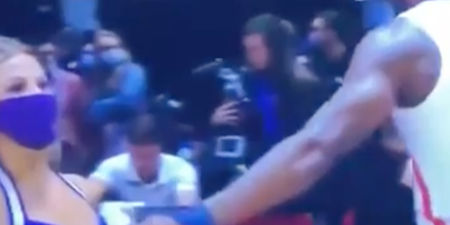 Viral video divides internet after basketball player appears to touch cheerleader’s chest