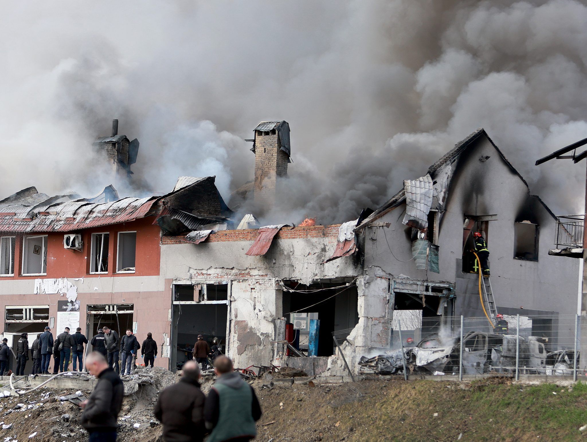 LVIV, UKRAINE - APRIL 18: Firefighters battle a blaze after a civilian building was hit by a Russian missile on April 18, 2022 in Lviv, Ukraine. At least six people were killed and eight wounded in missile strikes in different areas of the city, according to the governor. (Photo by Joe Raedle/Getty Images)