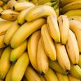 Man peels bananas before weighing them to save money