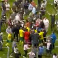 Swindon players appear to be attacked in pitch invasion following play-off defeat