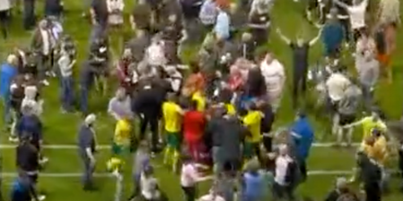 Swindon players appear to be attacked in pitch invasion following play-off defeat