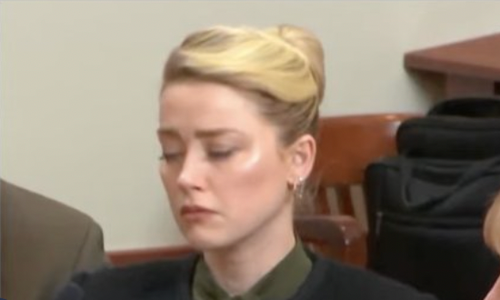 Amber Heard appears to get upset as explicit Johnny Depp text read to court