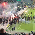 ADO Den Haag fans launch flares at opposition fans after play-off loss