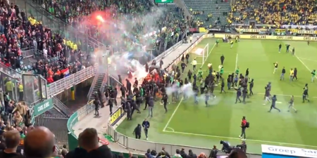 ADO Den Haag fans launch flares at opposition fans after play-off loss