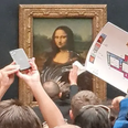 Man ‘dressed as old lady in wheelchair attacks Mona Lisa with cake in bizarre climate protest