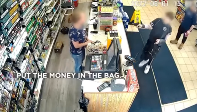 ‘Put the money in the bag’: Shocking footage shows boy, 12, allegedly carry out robbery at gunpoint