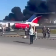 Shocking moment plane crash-lands at Miami Airport and bursts into flames