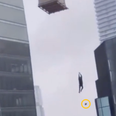 Terrifying video shows screaming construction worker dangling from crane hundreds of feet in the air