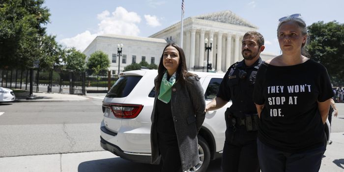 AOC faking being handcuffed