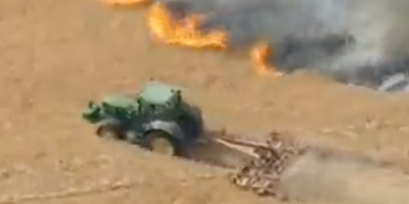 Moment heroic farmer desperately tries to slow down wildfire to save his neighbour’s home