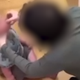 Man and woman arrested after footage appears to show baby given shot of vodka