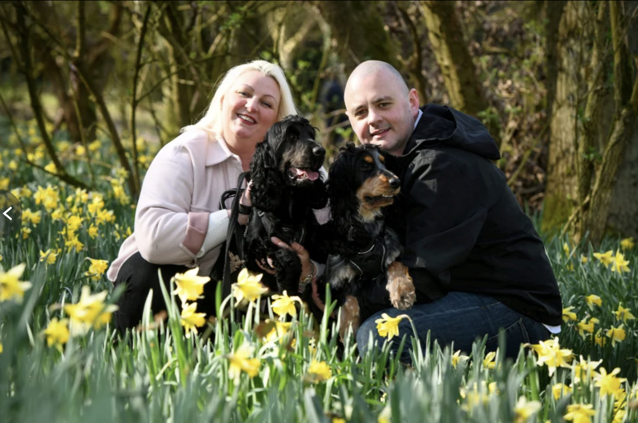 Laura Hoyle, Kirk Stevens and their two dogs (Image: SWNS)