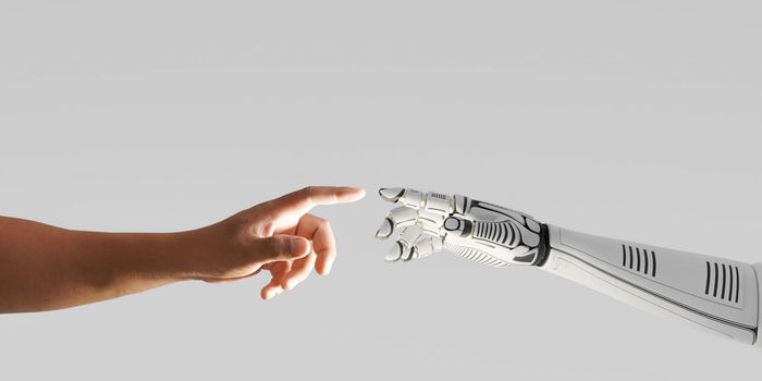 Robot hand touching with human hand stock photo