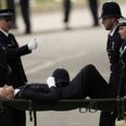 Police officer collapses and carried away on stretcher during Queen’s funeral