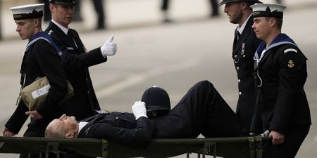 Police officer collapses and carried away on stretcher during Queen’s funeral