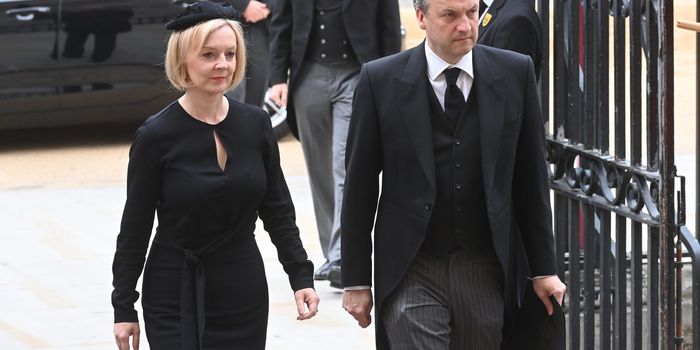 LONDON, ENGLAND - SEPTEMBER 19: British Prime Minister Liz Truss and husband Hugh O'Leary arrive for the State Funeral of Queen Elizabeth II at Westminster Abbey on September 19, 2022 in London, England. Elizabeth Alexandra Mary Windsor was born in Bruton Street, Mayfair, London on 21 April 1926. She married Prince Philip in 1947 and ascended the throne of the United Kingdom and Commonwealth on 6 February 1952 after the death of her Father, King George VI. Queen Elizabeth II died at Balmoral Castle in Scotland on September 8, 2022, and is succeeded by her eldest son, King Charles III. (Photo by Geoff Pugh - WPA Pool/Getty Images)