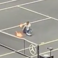 Protestor sets arm on fire after invading tennis court during Laver Cup