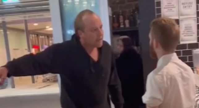 Man shouting at staff while point to rules in Karen's Diner, Brisbane