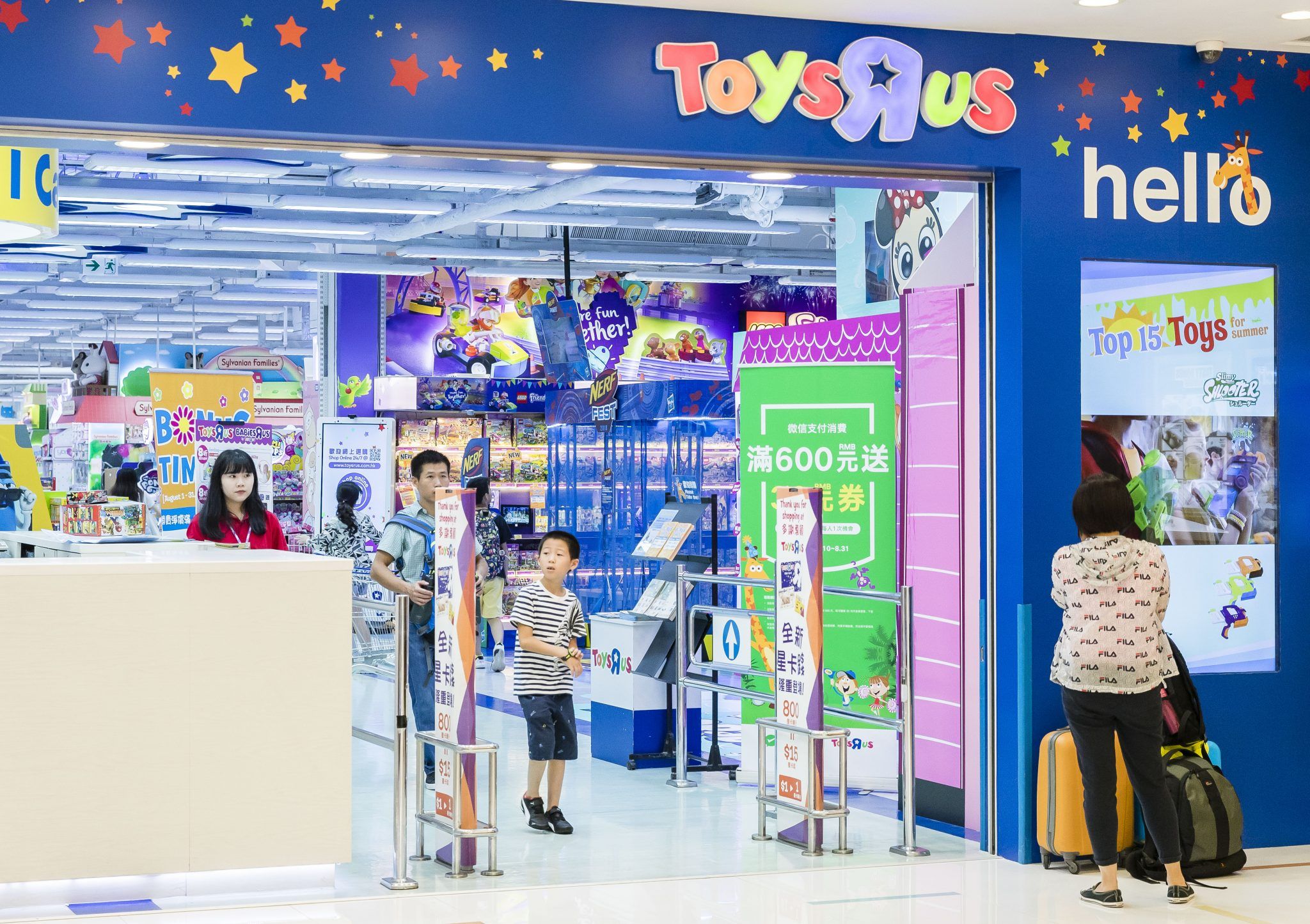 Shoppers walk towards to a Toys R US retail store at the Harbour City on August 23 2018 in Hong Kong, Hong Kong (Photo by Yu Chun Christopher Wong/S3studio/Getty Images)