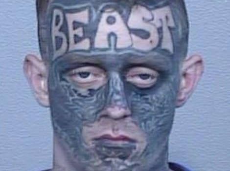 Jaimes Sutton with tattoo ink all over his face and "BEAST" tattooed on his forehead (Image: NSW Police)