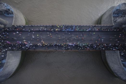 LONDON, ENGLAND - OCTOBER 02: Runners cross Tower Bridge during the London Marathon on October 02, 2022 in London, England. The view is as seen from the high-level glass floor of Tower Bridge above the River Thames. (Photo by Rob Pinney/Getty Images) (Photo by Rob Pinney/Getty Images)