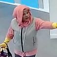Bizarre moment woman tries to rob  bank wearing a pair of yellow washing-up gloves