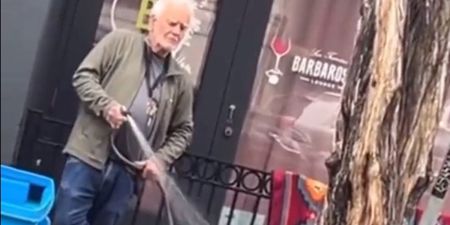 Gallery owner arrested after he was filmed spraying homeless woman with hose