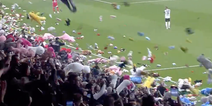 Besiktas and Antalyaspor fans throw stuffed toys onto pitch for earthquake victims