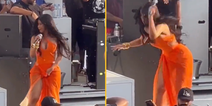 Cardi B throws microphone at fan who launched drink at her