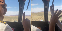Helicopter pilot screams at dozy passenger who tried to grab lever mid-air 