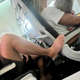 Plane passenger sparks outrage after putting his bare foot on armrest in front
