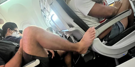 Plane passenger sparks outrage after putting his bare foot on armrest in front
